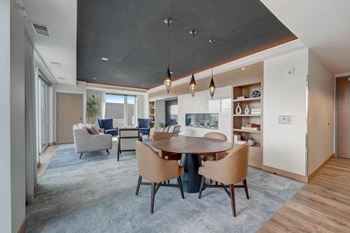 a large room with tables and chairs and rainbow colored lights